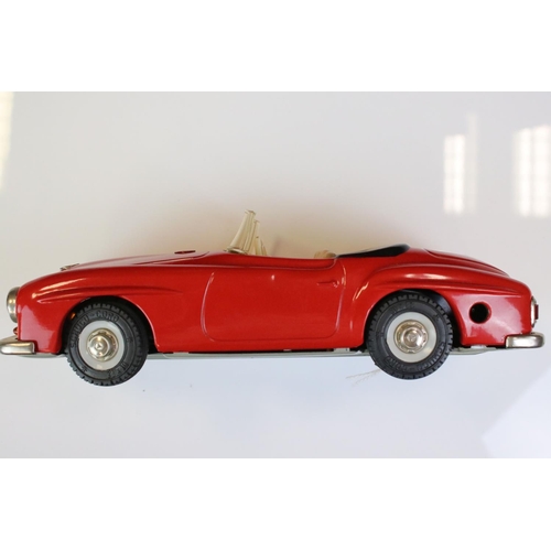 1291 - Schuco Clockwork tinplate remote control 2095 Mercedes 190 SL in red, with instructions and box tray