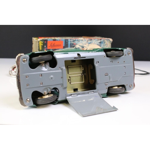 1292 - Schuco battery powered tin plate Alarm Police Car 5340 in green with cream roof and blue light, with... 