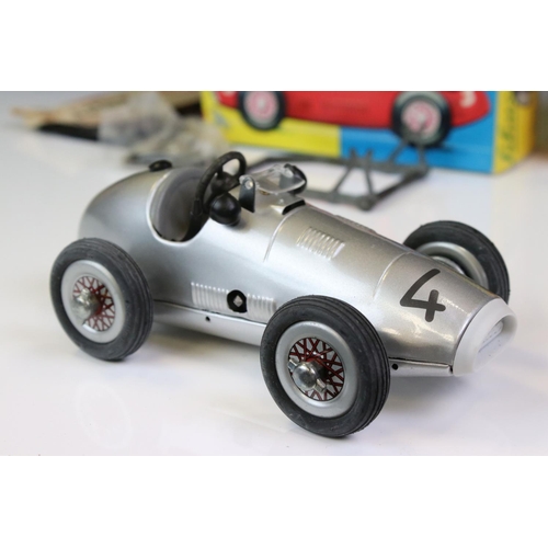 1294 - Two boxed Schuco Grand Prix Racer clockwork tin plate models to include 1071 in silver and 1070 in b... 