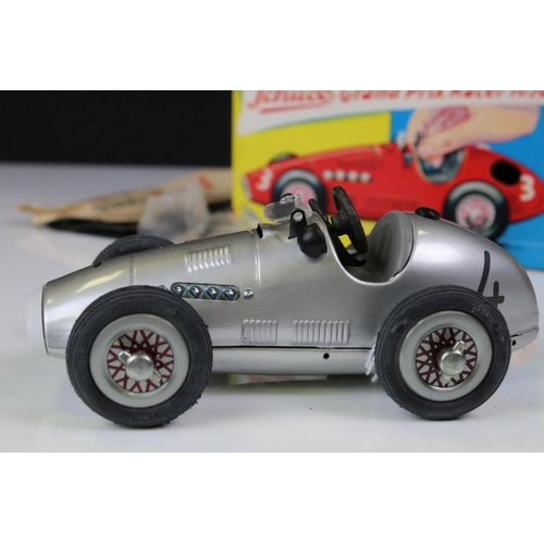 1294 - Two boxed Schuco Grand Prix Racer clockwork tin plate models to include 1071 in silver and 1070 in b... 