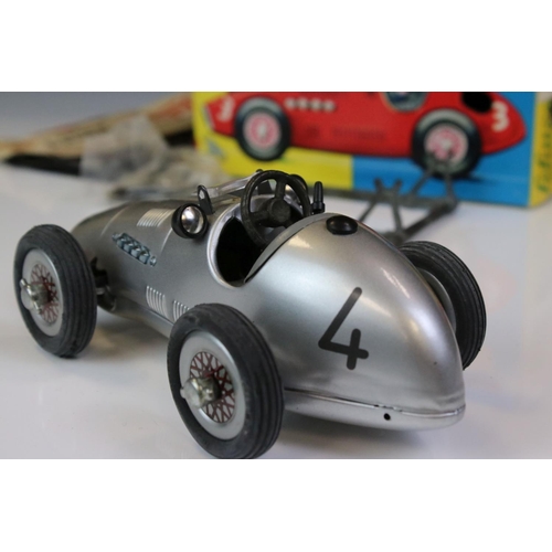 1294 - Two boxed Schuco Grand Prix Racer clockwork tin plate models to include 1071 in silver and 1070 in b... 