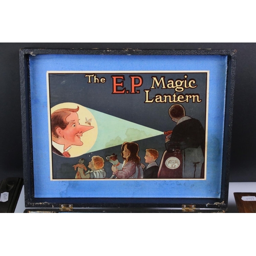 1395 - The EP Magic Lantern 'Lanterna Magica' with instructions, slides and paperwork plus 2 x additional w... 