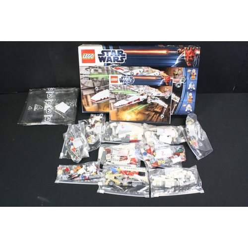 1423 - Star Wars - Three boxed Lego Star Wars sets to include 9496 Desert Skiff, 9492 TIE Fighter & 9493 X ... 