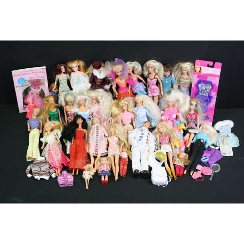 330 - Quantity of mainly contemporary dolls to include Barbie, Action Man etc plus a Dolls Fashion Antholo... 