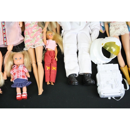 330 - Quantity of mainly contemporary dolls to include Barbie, Action Man etc plus a Dolls Fashion Antholo... 