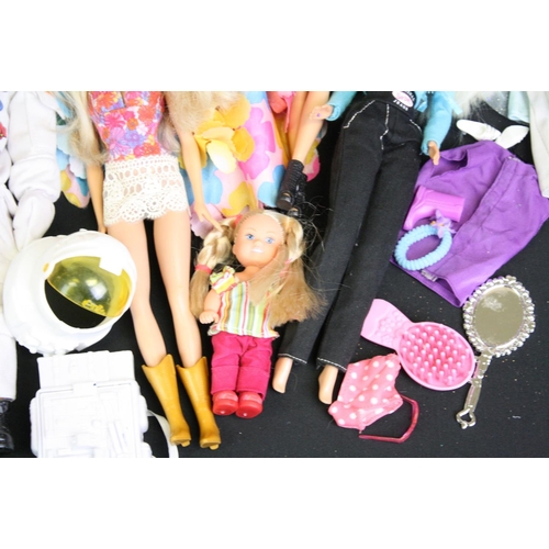 330 - Quantity of mainly contemporary dolls to include Barbie, Action Man etc plus a Dolls Fashion Antholo... 