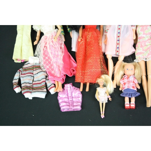 330 - Quantity of mainly contemporary dolls to include Barbie, Action Man etc plus a Dolls Fashion Antholo... 