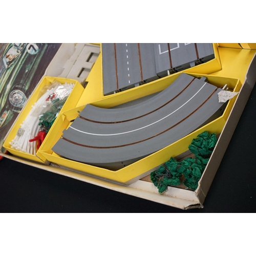 1208 - Collection of Triang Minic Motorways to include boxed M1522 set, 2 x boxed slot cars featuring Aston... 