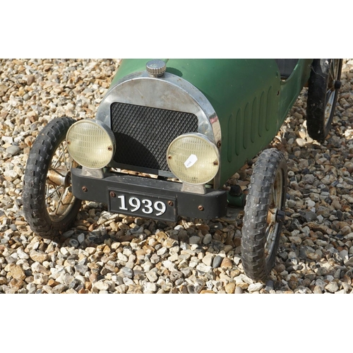 1171 - Vintage tin plate pedal car with 1939 registration, unmarked, green body with black seat, approx len... 