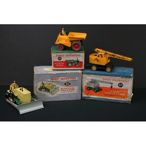 1222 - Three boxed Dinky Supertoys diecast models to include 562 Dumper Truck in yellow, 961 Blaw-Knox Bull... 