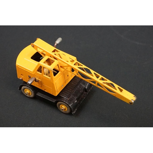 1222 - Three boxed Dinky Supertoys diecast models to include 562 Dumper Truck in yellow, 961 Blaw-Knox Bull... 