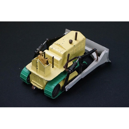 1222 - Three boxed Dinky Supertoys diecast models to include 562 Dumper Truck in yellow, 961 Blaw-Knox Bull... 