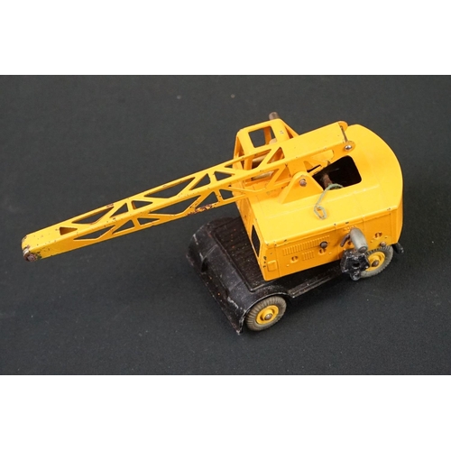 1222 - Three boxed Dinky Supertoys diecast models to include 562 Dumper Truck in yellow, 961 Blaw-Knox Bull... 