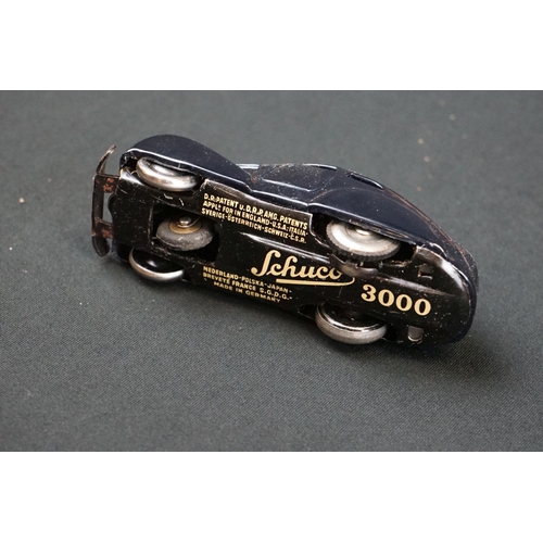 1225 - Two boxed Schuco clockwork tin plate cars to include Telesteering Car 3000 in black complete with al... 