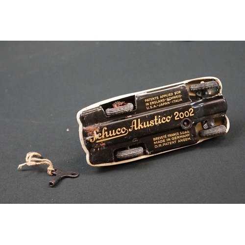 1225 - Two boxed Schuco clockwork tin plate cars to include Telesteering Car 3000 in black complete with al... 