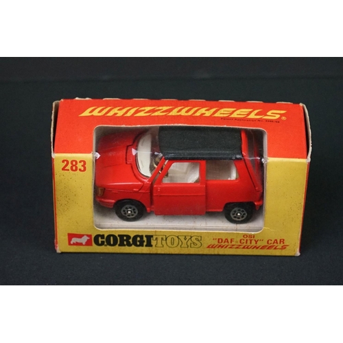 1230 - Three boxed Corgi diecast models to include 341 Mini Marcos GT 850 in metallic red, Whizzwheels 283 ... 