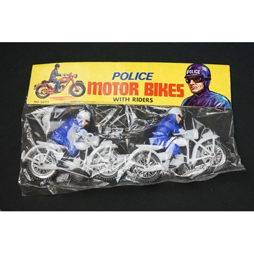 1250 - Eight vintage motorbike related toys to include Auburn USA rubber military motorbike & sidecar, Dink... 