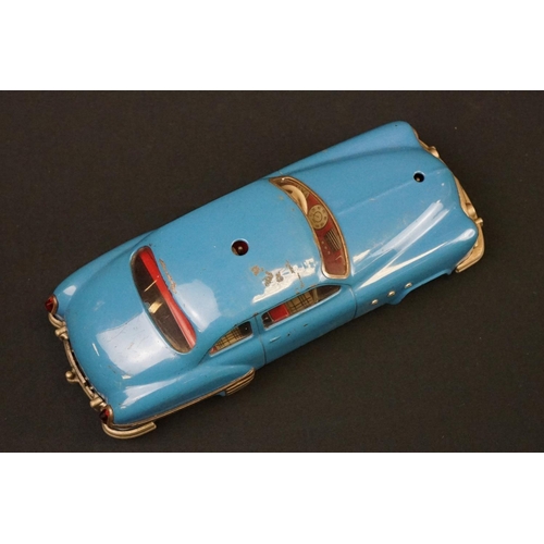 1254 - Three Schuco Ingenico tinplate clockwork cars to include 2 x 5380 (1 x blue & 1 x burgundy) and 5325... 