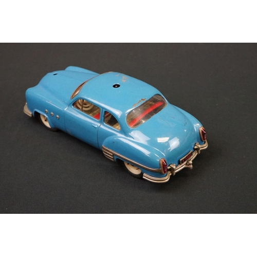 1254 - Three Schuco Ingenico tinplate clockwork cars to include 2 x 5380 (1 x blue & 1 x burgundy) and 5325... 