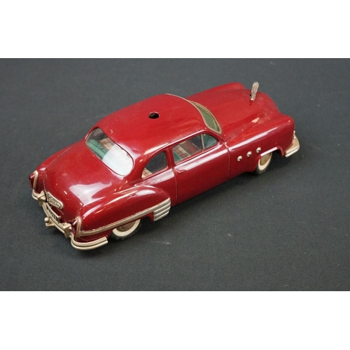 1254 - Three Schuco Ingenico tinplate clockwork cars to include 2 x 5380 (1 x blue & 1 x burgundy) and 5325... 