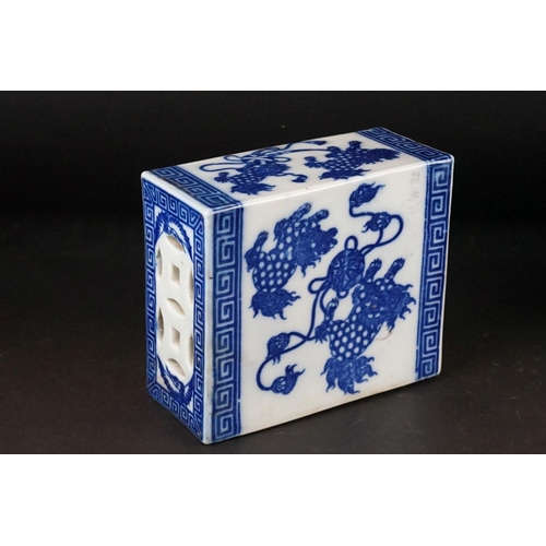 100 - Chinese Ceramic Blue and White Opium Pillow with pierced ends, decorated with Dogs of Foo, 13cm high... 