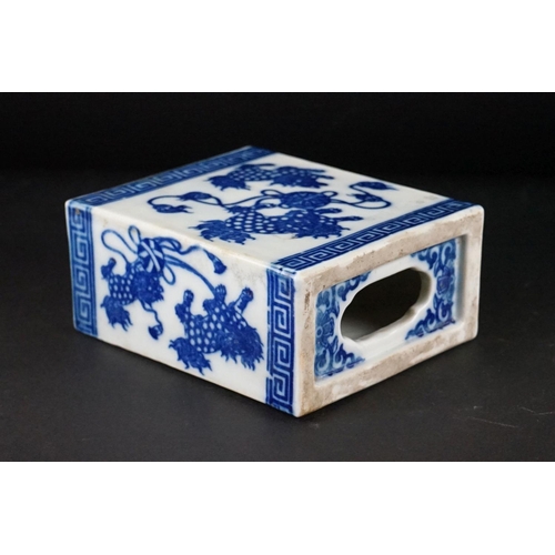 100 - Chinese Ceramic Blue and White Opium Pillow with pierced ends, decorated with Dogs of Foo, 13cm high... 