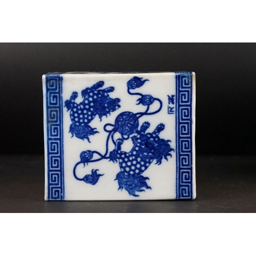 100 - Chinese Ceramic Blue and White Opium Pillow with pierced ends, decorated with Dogs of Foo, 13cm high... 