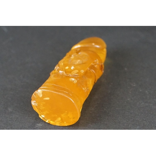 308 - A carved amber Japanese Netsuke pendant in the form of a phallus