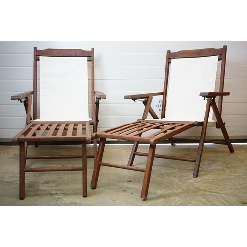 634 - Pair of Hardwood Folding Steamer Chairs with detachable foot rests and new cream canvas seats