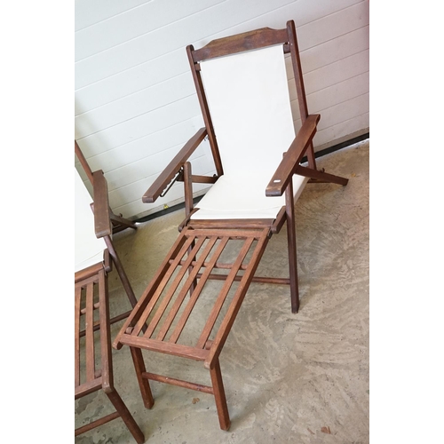 634 - Pair of Hardwood Folding Steamer Chairs with detachable foot rests and new cream canvas seats