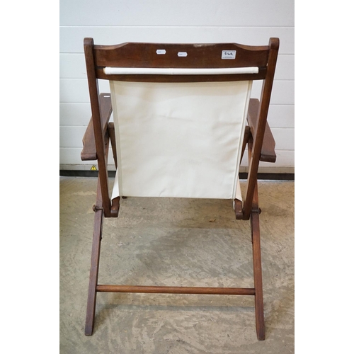 634 - Pair of Hardwood Folding Steamer Chairs with detachable foot rests and new cream canvas seats