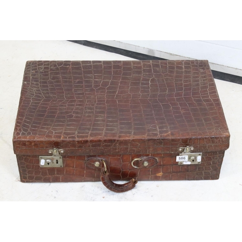 428 - Early 20th century Crocodile Skin Suitcase with applied luggage label, 70cm long x 22cm high