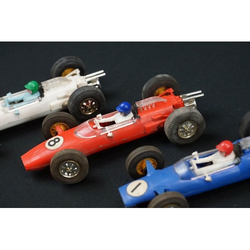 1245 - Five Triang Scalextric slot cars to include 2 x Austin Mini Cooper in green (missing a wheel) and re... 