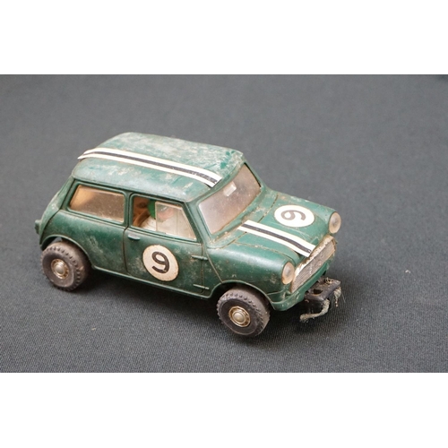 1245 - Five Triang Scalextric slot cars to include 2 x Austin Mini Cooper in green (missing a wheel) and re... 