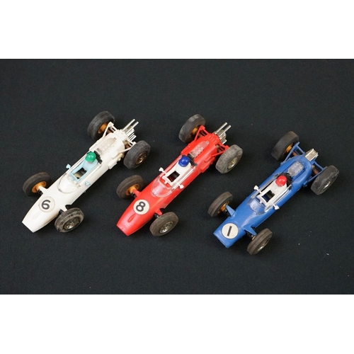 1245 - Five Triang Scalextric slot cars to include 2 x Austin Mini Cooper in green (missing a wheel) and re... 