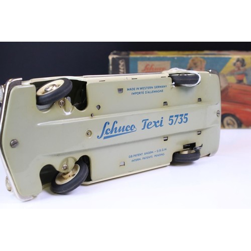 1278 - Original boxed Schuco 5735 Texi tin plate model in cream, female driver, with instructions and steer... 