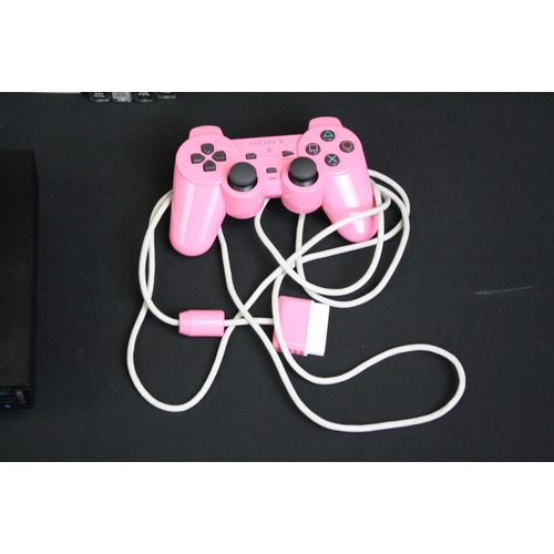 1447 - Retro Gaming - Two Games Consoles to include PlayStation 2 console with 1 x official pink controller... 