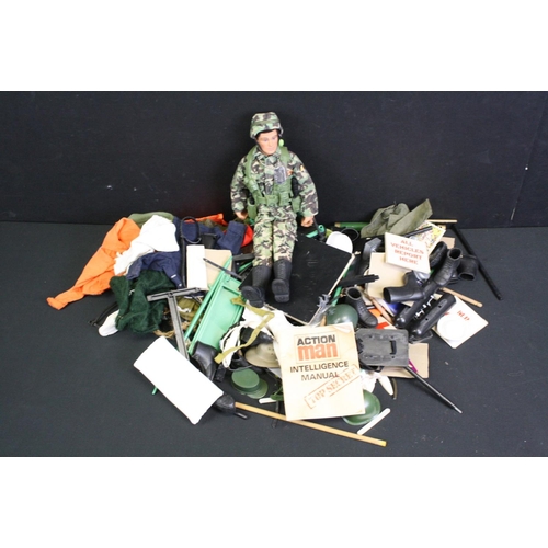 1373 - One dressed Action Man figure with a quantity of accessories, to include clothing, weapons, life raf... 