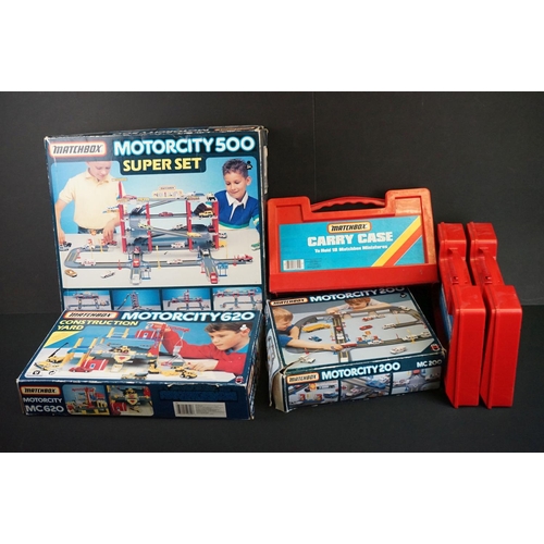 1180 - Three Matchbox carrycases enclosing a total of 50 diecast models, together with boxed Matchbox Motor... 