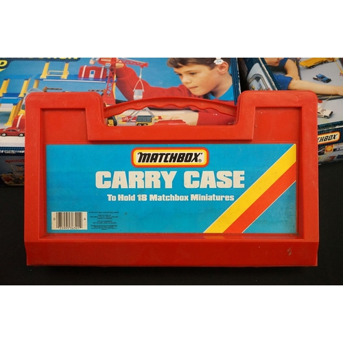 1180 - Three Matchbox carrycases enclosing a total of 50 diecast models, together with boxed Matchbox Motor... 