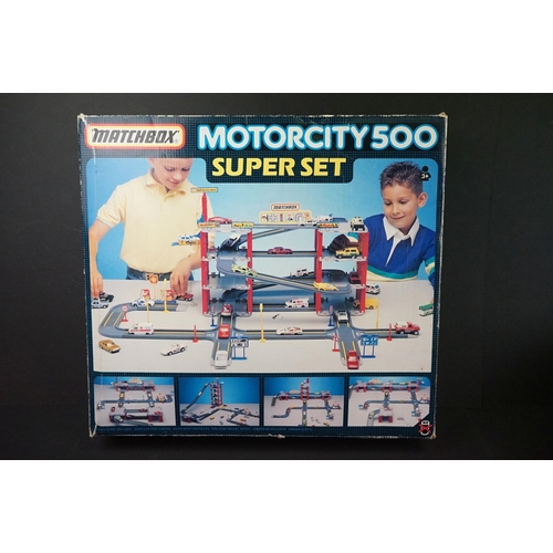 1180 - Three Matchbox carrycases enclosing a total of 50 diecast models, together with boxed Matchbox Motor... 