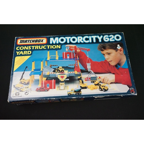 1180 - Three Matchbox carrycases enclosing a total of 50 diecast models, together with boxed Matchbox Motor... 