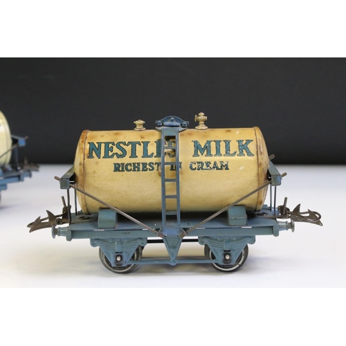 232 - Four Hornby O gauge Nestle Milk Tank Wagon to include green bed version, black bed version and 2 x b... 