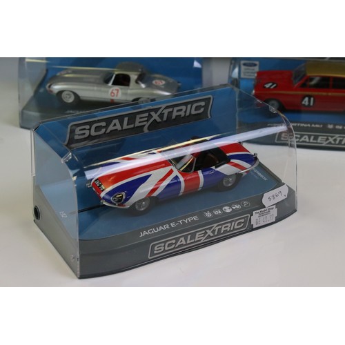 1033 - Four cased Scalextric slot cars to include C3722 Aston Martin DB5 red, C3952 Jaguar E Type Nurburgri... 