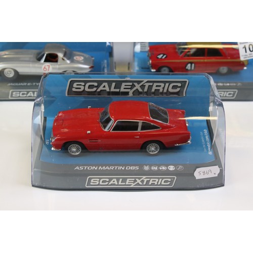 1033 - Four cased Scalextric slot cars to include C3722 Aston Martin DB5 red, C3952 Jaguar E Type Nurburgri... 