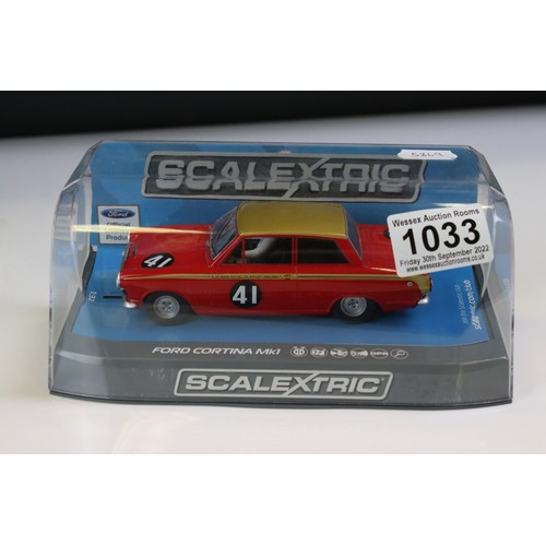 1033 - Four cased Scalextric slot cars to include C3722 Aston Martin DB5 red, C3952 Jaguar E Type Nurburgri... 