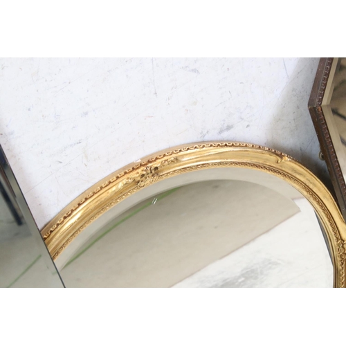 562 - Four Mirrors including oak framed with beaded edge, 64cm long and an Oval Gilt Framed Mirror