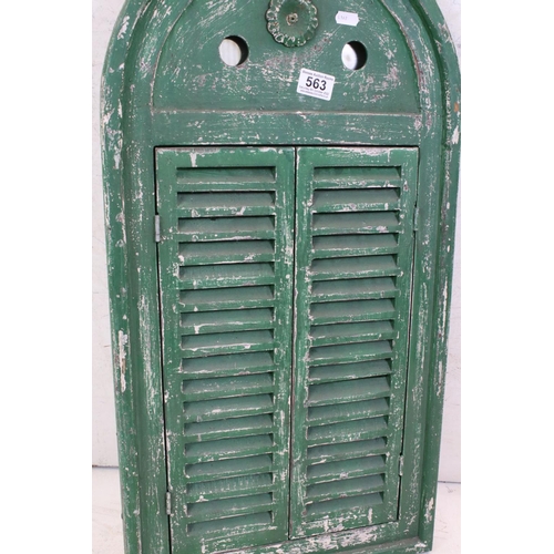 563 - Green Painted Arched Door, the two slatted doors opening to a mirror, 75cm x 39cm