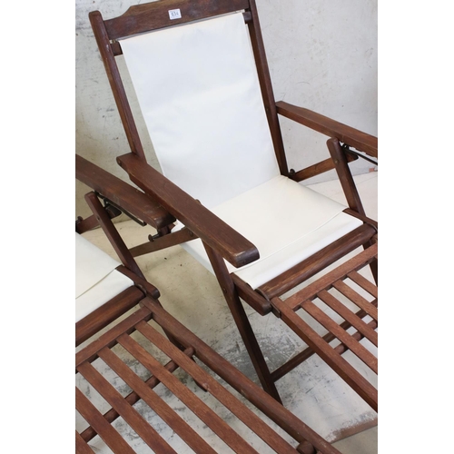 634 - Pair of Hardwood Folding Steamer Chairs with detachable foot rests and new cream canvas seats