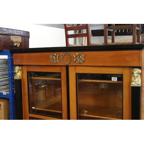 635 - French Empire style Satinwood and Ebonised Display Cabinet with figural metal capped square columns,... 